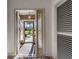 Bright entryway with a view of a courtyard through glass doors at 10520 Collar Dr, San Antonio, FL 33576