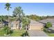 Single-Gathering home with two-car garage and landscaped yard at 10520 Collar Dr, San Antonio, FL 33576