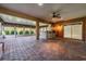 Outdoor kitchen with built-in grill and brick-paved patio at 10520 Collar Dr, San Antonio, FL 33576