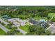 Aerial view of community amenities including clubhouse, pool, and tennis courts at 10520 Collar Dr, San Antonio, FL 33576