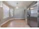 Bright kitchen with stainless steel appliances and tile floor at 10520 Collar Dr, San Antonio, FL 33576