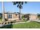 House exterior showcasing landscaping and a two-car garage at 10520 Collar Dr, San Antonio, FL 33576
