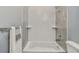 Clean bathroom with shower/tub combo and wave patterned tile at 2921 Sanchez St, Tampa, FL 33605