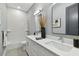 Modern bathroom with double vanity and wave patterned tile at 2921 Sanchez St, Tampa, FL 33605