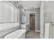 Bright bathroom with a soaking tub, double vanity and access to a walk-in closet at 2921 Sanchez St, Tampa, FL 33605