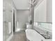Spa-like bathroom featuring a freestanding tub and a large shower at 2921 Sanchez St, Tampa, FL 33605