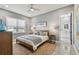 Spacious bedroom with wood bed frame and ensuite bathroom access at 2921 Sanchez St, Tampa, FL 33605