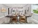 Elegant dining room features a dark wood table and neutral colored chairs at 2921 Sanchez St, Tampa, FL 33605