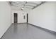 Spacious garage with epoxy flooring and extra storage at 2921 Sanchez St, Tampa, FL 33605