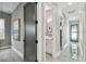 Bright hallway with access to additional rooms and a half bathroom at 2921 Sanchez St, Tampa, FL 33605