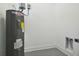 Interior laundry room with water heater and utility hookups at 2921 Sanchez St, Tampa, FL 33605