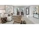 Cozy living room with a neutral color scheme, wicker chairs, and large artwork at 2921 Sanchez St, Tampa, FL 33605