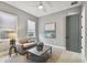 Bright sitting room featuring a comfy sofa and large artwork at 2921 Sanchez St, Tampa, FL 33605