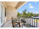 Cozy balcony featuring tile floor, metal railings and views of the street at 5902 Yeats Manor Dr, Tampa, FL 33616