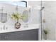 Bathroom boasts double vanity, modern fixtures, and a spacious glass-enclosed shower at 5902 Yeats Manor Dr, Tampa, FL 33616