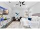 Calm bedroom with a ceiling fan, comfortable furnishings, and contemporary decor at 5902 Yeats Manor Dr, Tampa, FL 33616