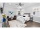 Serene bedroom features a plush bed, ceiling fan, and ample natural light at 5902 Yeats Manor Dr, Tampa, FL 33616