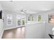 Bonus room with wood floors leading to a walkout balcony at 5902 Yeats Manor Dr, Tampa, FL 33616
