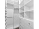 Walk-in closet with an organized shelving and drawer system at 5902 Yeats Manor Dr, Tampa, FL 33616