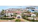 Beautiful building exterior with palm trees, well-manicured landscaping, and circular driveway at 5902 Yeats Manor Dr, Tampa, FL 33616