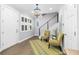 Bright foyer featuring hardwood floors, modern staircase, contemporary lighting, and fresh, neutral colors at 5902 Yeats Manor Dr, Tampa, FL 33616