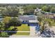 Aerial view of the house and pool in a residential area at 8514 Woodwick Ct, Tampa, FL 33615