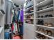 Large walk-in closet with ample shelving and hanging space at 10433 Canary Isle Dr, Tampa, FL 33647