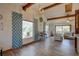 Spacious living room with vaulted ceiling, hardwood floors, and large windows at 1106 Oxbow Rd, Wimauma, FL 33598