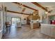 Open kitchen with wood cabinets, stainless steel appliances, and breakfast bar at 1106 Oxbow Rd, Wimauma, FL 33598