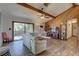 Open living room with wood-paneled walls and access to deck at 1106 Oxbow Rd, Wimauma, FL 33598