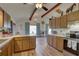 Open kitchen with island and stainless steel appliances at 1106 Oxbow Rd, Wimauma, FL 33598