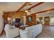 Living room with wood-paneled accent wall and a view into the kitchen at 1106 Oxbow Rd, Wimauma, FL 33598