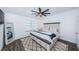 Main bedroom with king-size bed and ceiling fan at 2444 Foggy Creek Cir, Clearwater, FL 33764