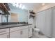 Clean bathroom with granite countertop, white cabinets, and shower/tub combo at 2444 Foggy Creek Cir, Clearwater, FL 33764