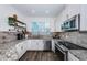 Modern kitchen with stainless steel appliances and granite countertops at 2444 Foggy Creek Cir, Clearwater, FL 33764