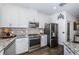 Kitchen features stainless steel appliances and granite countertops at 2444 Foggy Creek Cir, Clearwater, FL 33764