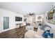 Spacious living room with comfortable sectional sofa and large TV at 2444 Foggy Creek Cir, Clearwater, FL 33764