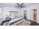 Main bedroom with king-size bed and en-suite bathroom at 2444 Foggy Creek Cir, Clearwater, FL 33764