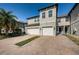 Two-story townhome with two-car garage and attractive landscaping at 2444 Foggy Creek Cir, Clearwater, FL 33764