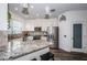 Modern kitchen with granite countertops and stainless steel appliances at 2444 Foggy Creek Cir, Clearwater, FL 33764