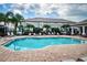 Relaxing community pool area with plenty of lounge chairs at 2444 Foggy Creek Cir, Clearwater, FL 33764