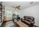 Bright office space with leather couch, desk, and large windows at 2444 Foggy Creek Cir, Clearwater, FL 33764