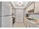 Efficient kitchen with white cabinets and stainless steel sink at 1012 Pearce Dr # 209, Clearwater, FL 33764
