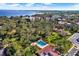 Community pool with lush landscaping and water views at 1012 Pearce Dr # 209, Clearwater, FL 33764