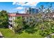 Building exterior with red tile roofs and lush landscaping at 1012 Pearce Dr # 209, Clearwater, FL 33764