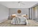 Bright bedroom with a queen bed and ceiling fan at 1012 Pearce Dr # 209, Clearwater, FL 33764