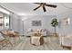 Living room features neutral tones, comfortable seating, and a ceiling fan at 1012 Pearce Dr # 209, Clearwater, FL 33764