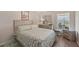 Guest bedroom with a queen-size bed and ample closet space at 1232 Corinth Greens Dr, Sun City Center, FL 33573