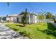 House exterior showcasing landscaping and grey siding at 2921 Sanchez St, Tampa, FL 33605
