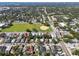 Aerial view of a residential neighborhood showcasing houses and a park at 2921 Sanchez St, Tampa, FL 33605